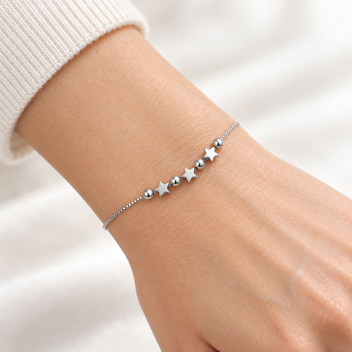 Bracelet avec étoiles et sphères ajourées en argent 925