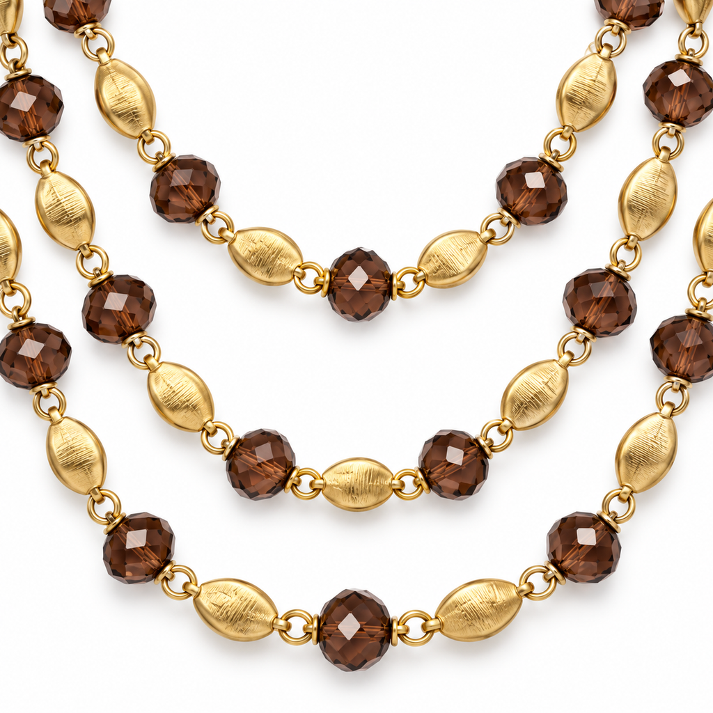 Collana lunga multifilo con cristalli e dettagli sfaccettati