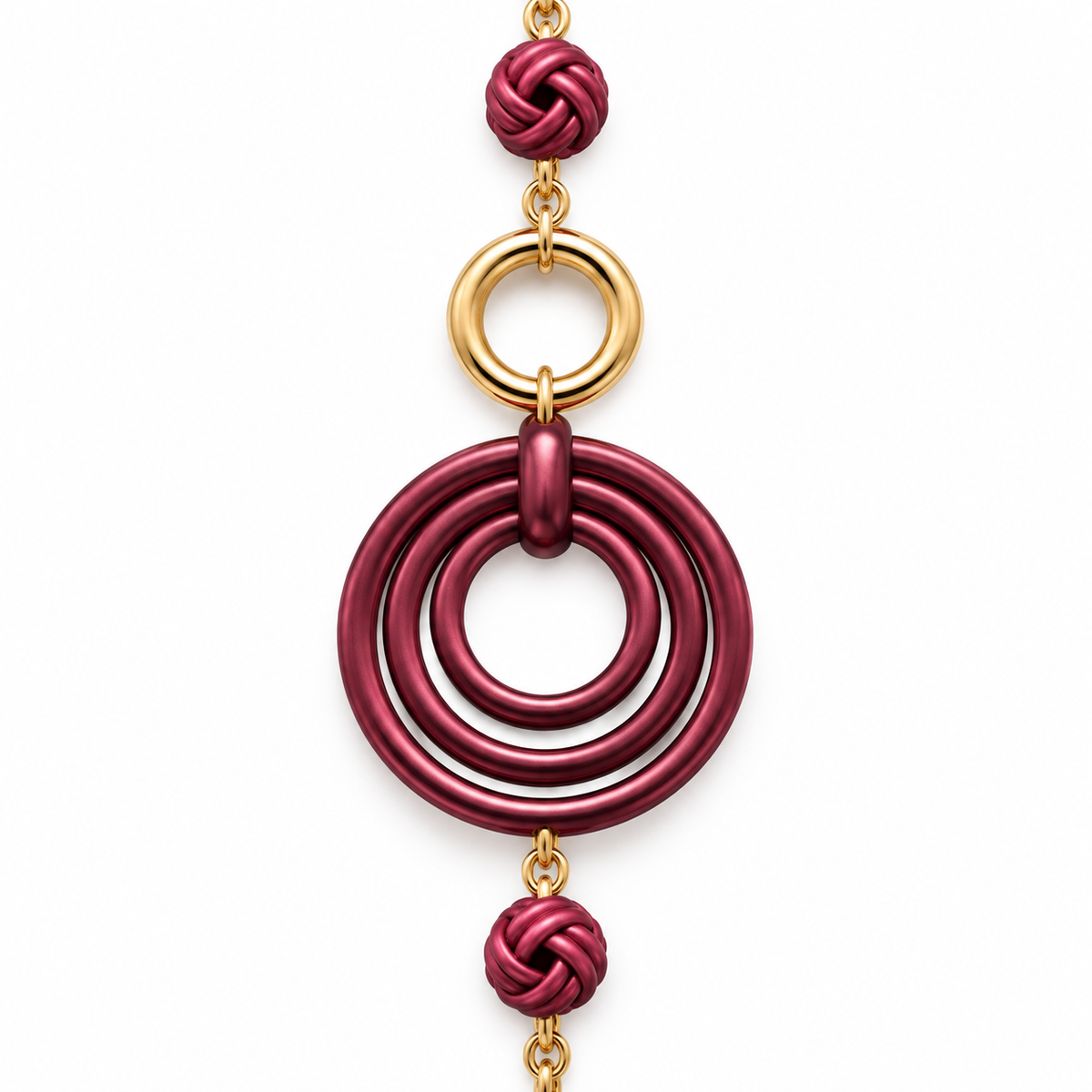 Collana lunga in acciaio inox con cerchi concentrici e nodi decorativi