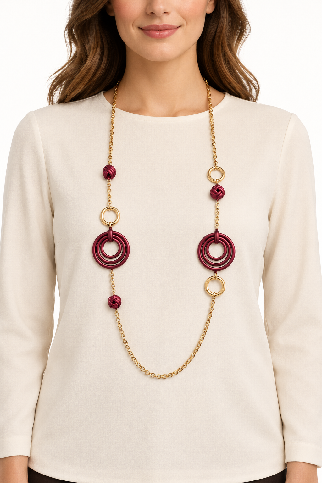 Collana lunga in acciaio inox con cerchi concentrici e nodi decorativi